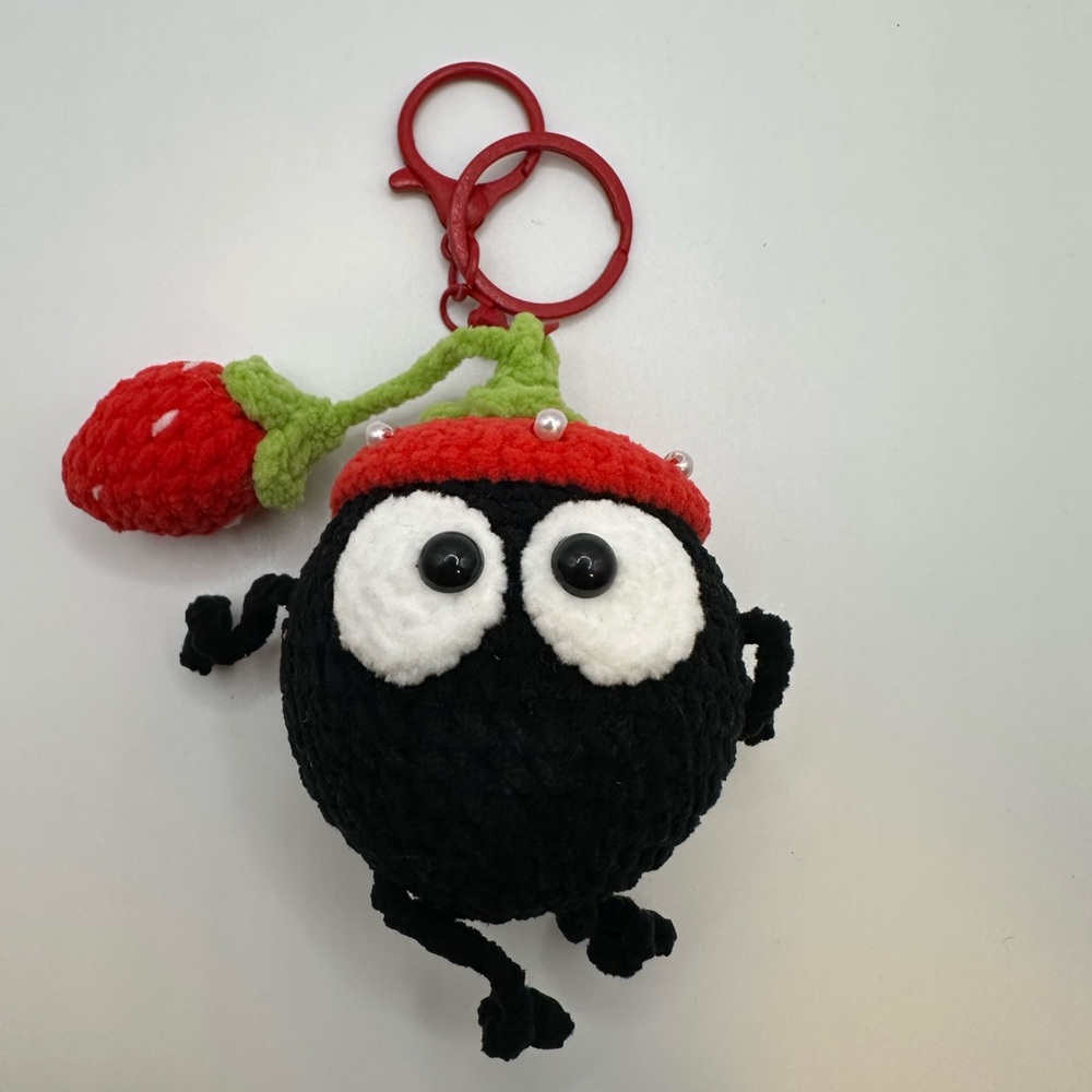 Black Plush Keychain with Red Strawberry Accent